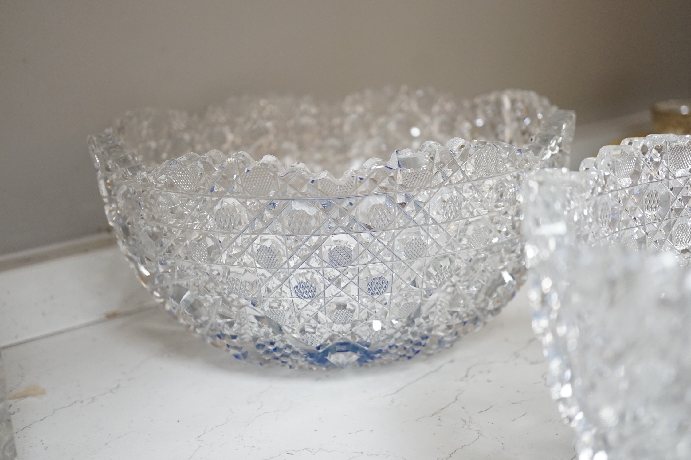 A Pair of Bohemian or Czech heavy cuts glass fruit bowls with blue flashed centres, 22.5 cm diameter, two decanters and six tumblers.